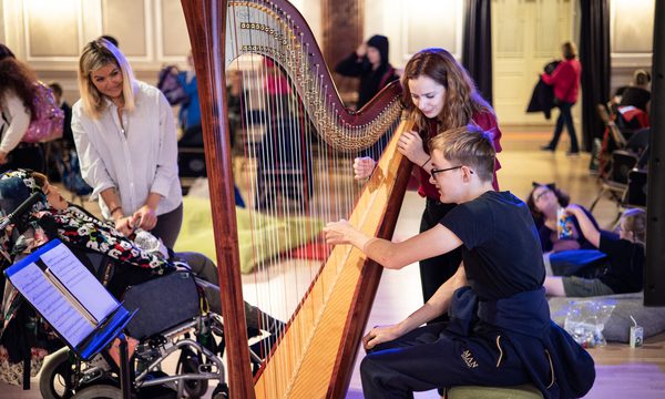 Child playing the harp