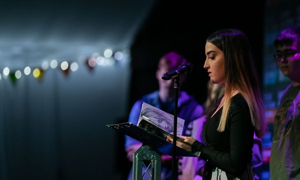 Young person on stage at Write Now