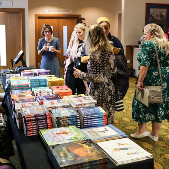 Teachers grabbing books at the conference