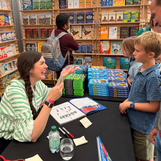 author signing smile at sf25