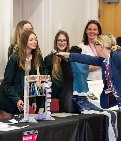 A student speaking into a microphone at Dataface Day