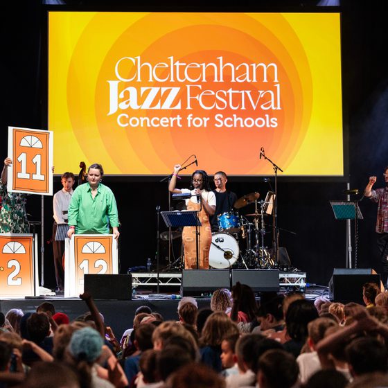 A shot from the back of the audience showing the band on stage at Jazz Concert for Schools 2025