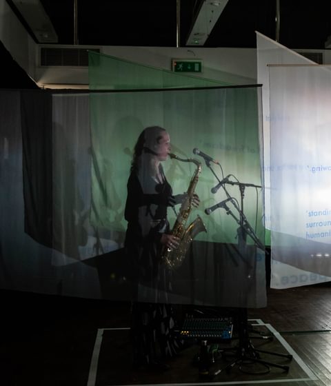 lady with saxophone with presentation