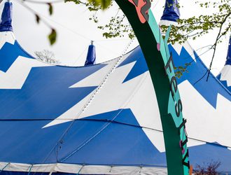 A picture of the Big Top and Cheltenham Jazz Festival arch