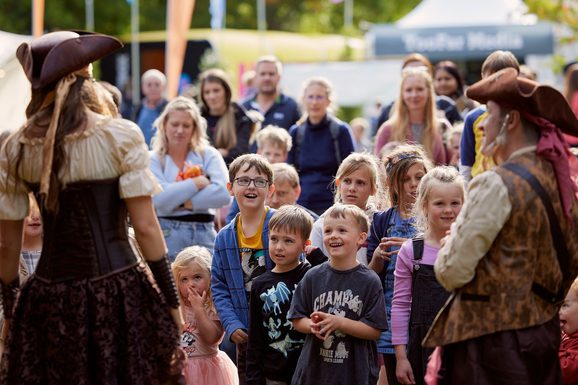 Pirate characters engaging with children