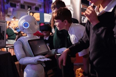 Child interacting with robot