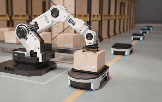 A robotic arm packing boxes
