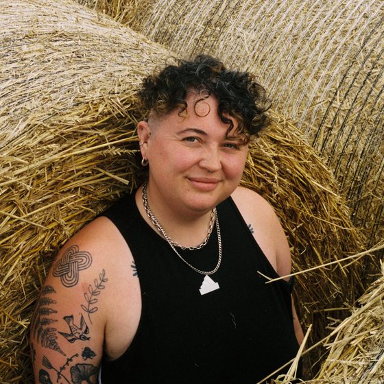 Headshot of Em Merrin May Armstrong