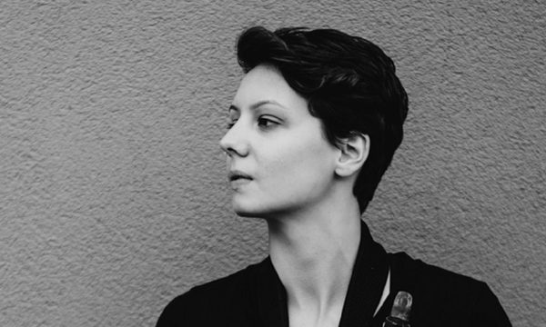 A black and white headshot of Lara Jones