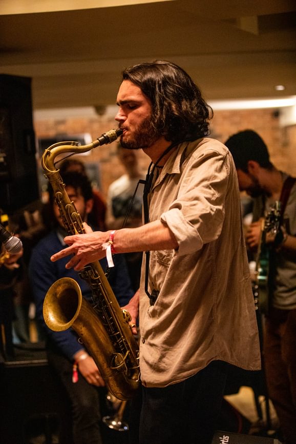 A man playing the saxophone