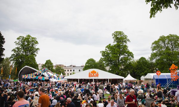 An image of a busy Festival site, with the Festival Bar in the centre.