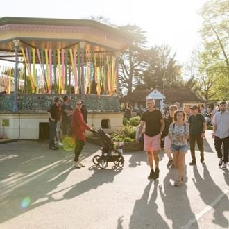 Bandstand with people walking past