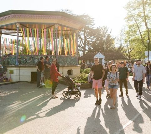 Bandstand with people walking past