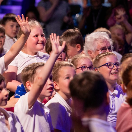 A crowd of school children laughing at Jazz Concert for Schools 2025