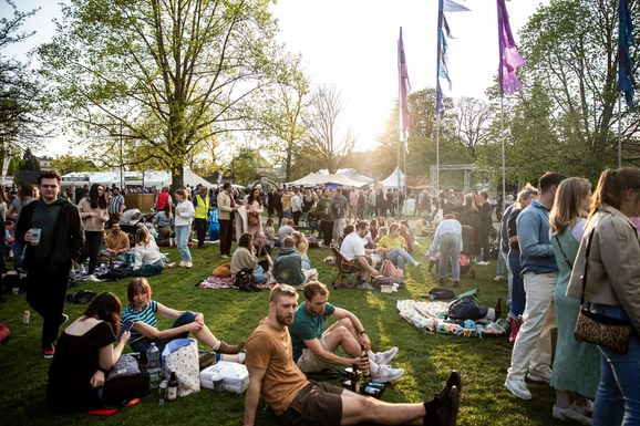 festival-goers sat on grass at JF 23