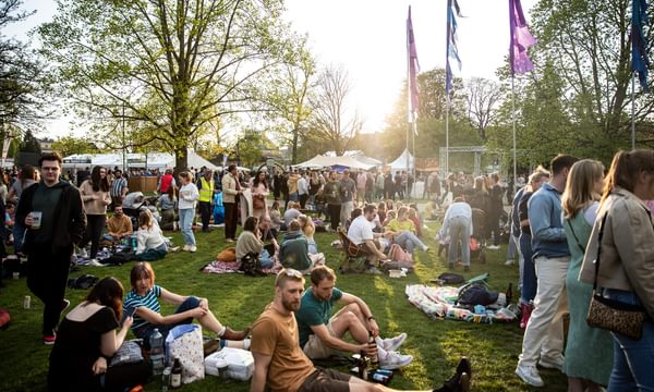 festival-goers sat on grass at JF 23