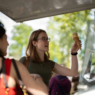 two UoG students buying ice cream at JF24