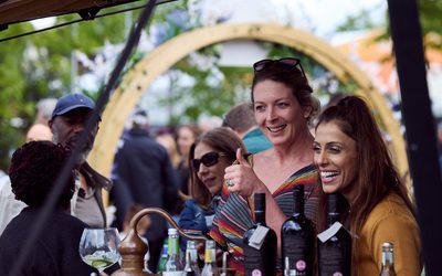 three women at Distillery bar on site at JF24