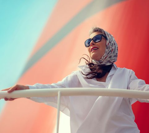 A woman stood in front of a ship funnel