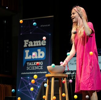 Famelab participant performing on stage