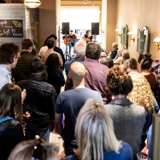 busy crowd in for the saints coffee shop