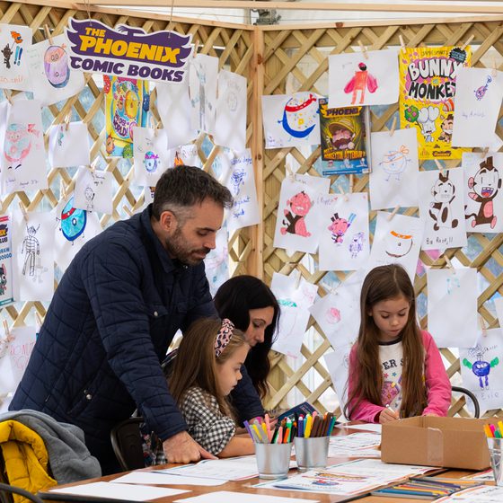 A family of four at Comic Corner at Cheltenham Literature Festival 2025.