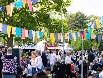 Crowds under colourful bunting at the Jazz Festival