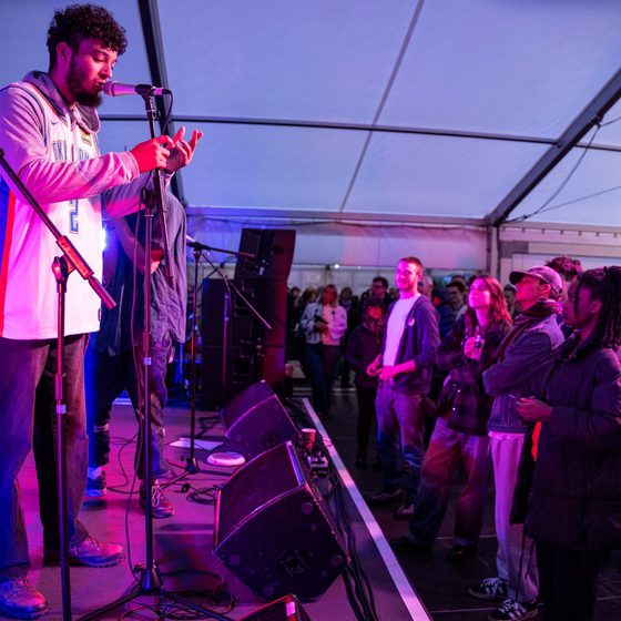 side stage view - GS Collective with purple tint