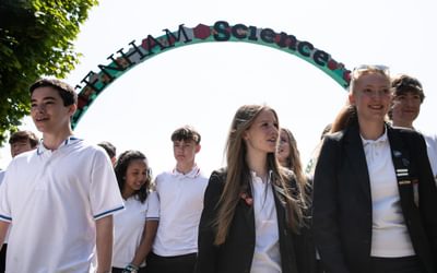 School children under arch at Science Festival