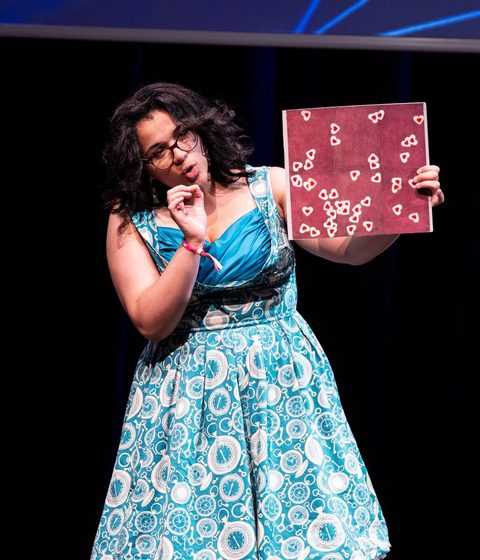 Finalist on stage at FameLab UK Final 2024
