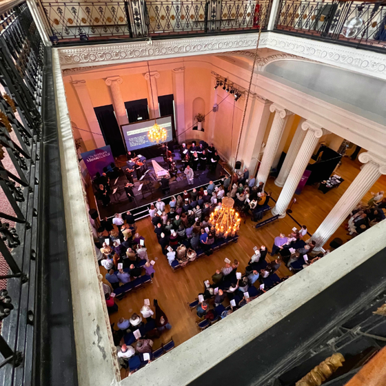 A shot from above of a crowd watching a performance