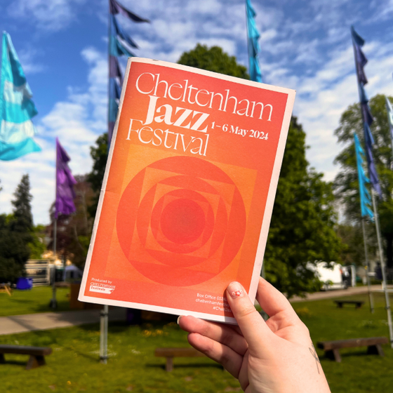 Hand holding Jazz Festival brochure
