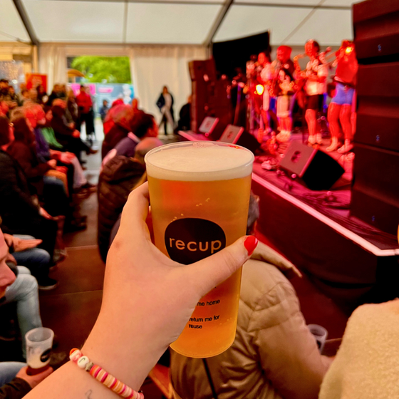 Beer in hand at free stage