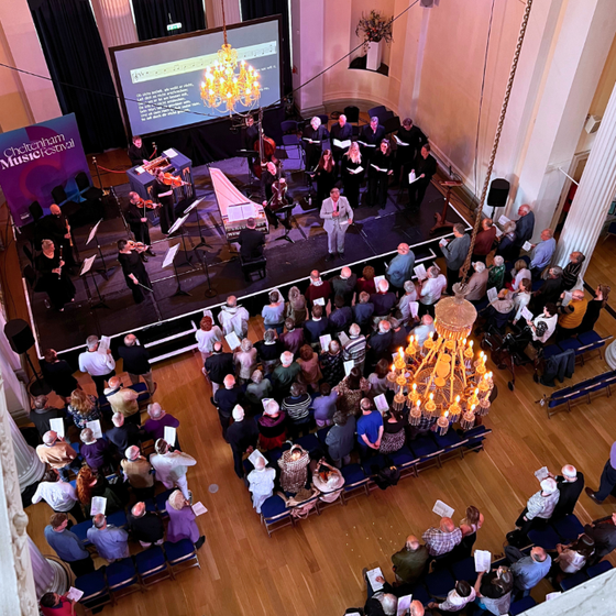 A shot from above of crowds watching a concert at Cheltenham Music Festival
