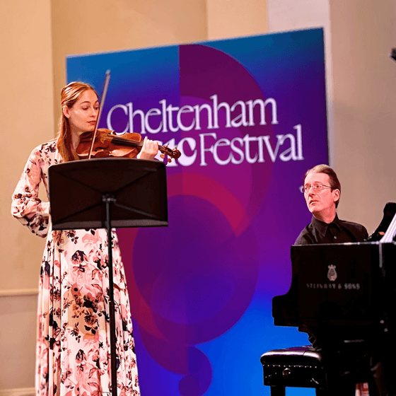 A violinist on stage at Cheltenham Music Festival
