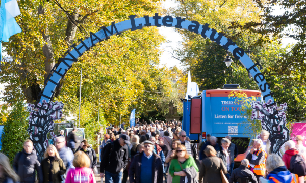 The Arch at the Literature Festival, with crowds of people walking through the Festival village